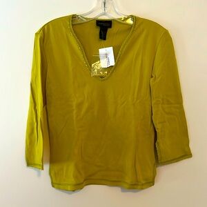 Vneck knit long sleeve women’s top with h beading on the neck and cuffs